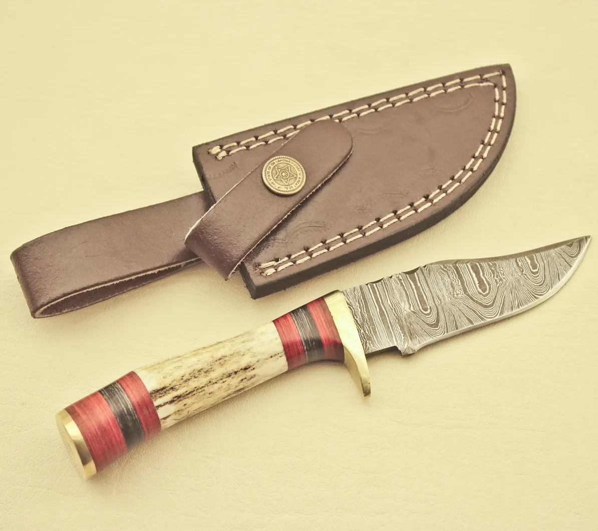 Hand-Forged-Damascus-Steel-Hunting-Knife-Knife-Stag-Horn-Handle-Leather-Sheath-e1774950056453.webp